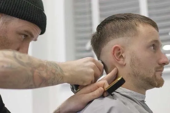 Clipper work on a client's neckline and beard at Barber Lounge