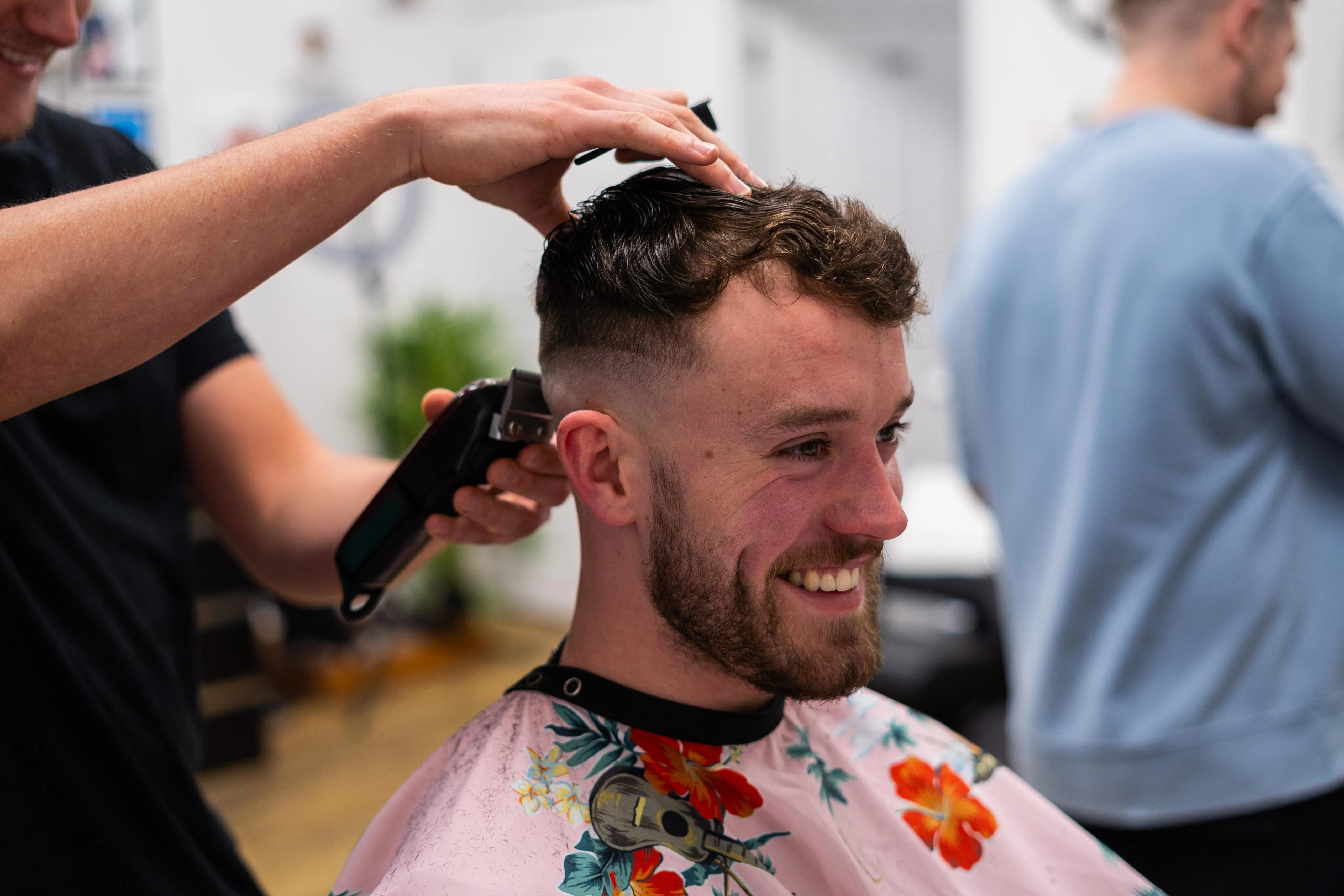 A smiling client mid-cut at Barber Lounge